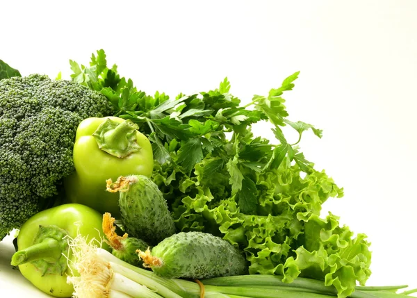 Various green vegetables (peppers, broccoli, cucumbers, green onions, lettuce) — Stock Photo, Image