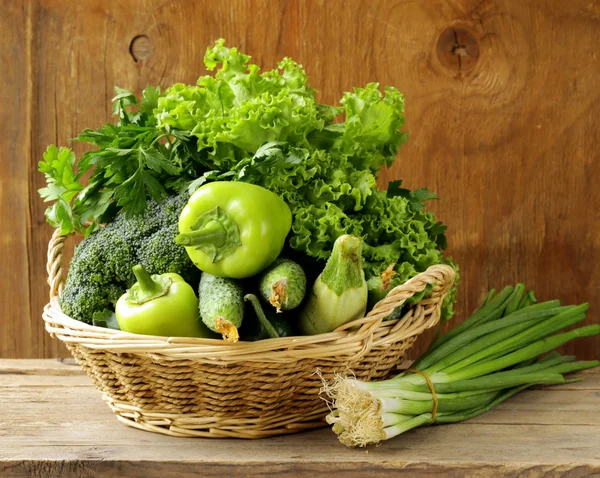 Various green vegetables (peppers, broccoli, cucumbers, green onions, lettuce) — Stock Photo, Image