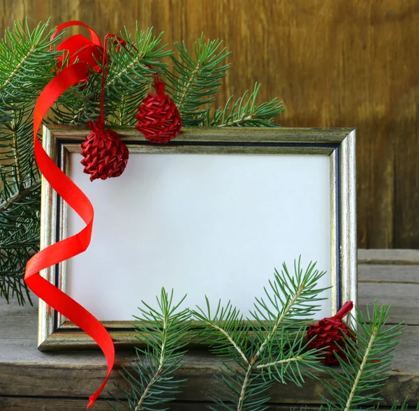 Christmas wooden gold frame and fir tree branches — Stock Photo, Image