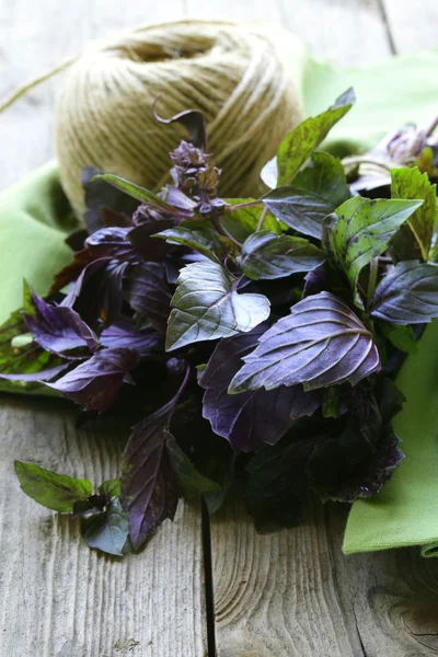 Bunch of purple basil on a wooden table