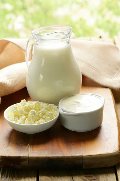 Still life of dairy products (milk, sour cream, cheese, cottage cheese) — Stock Photo, Image