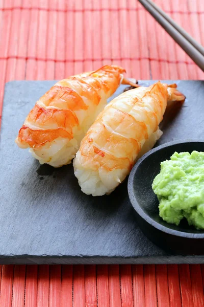 Portion of sushi with shrimp on a stone plate — Stock Photo, Image