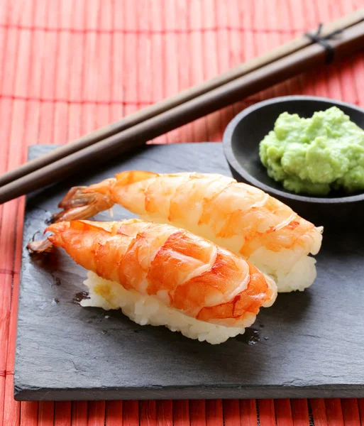 Portion of sushi with shrimp on a stone plate — Stock Photo, Image