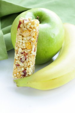 Granola bar, green apple and banana - healthy eating clipart