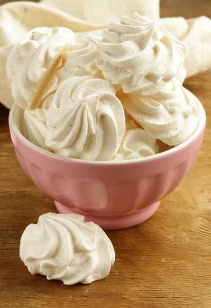 Cookies meringue (whipped egg whites and sugar) on a wooden table — Stock Photo, Image