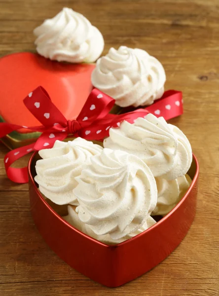 Cookies meringue (whipped egg whites and sugar) on a wooden table — Stock Photo, Image