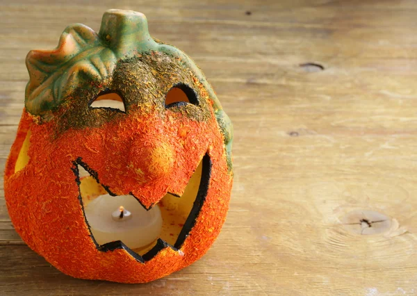 Halloween pumpkin Jack O'Lantern on a wooden background — Stock Photo, Image