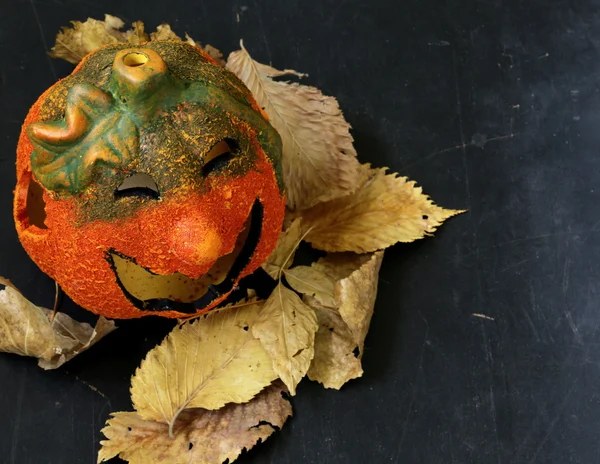 Halloween pumpkin Jack O'Lantern on a wooden background — Stock Photo, Image