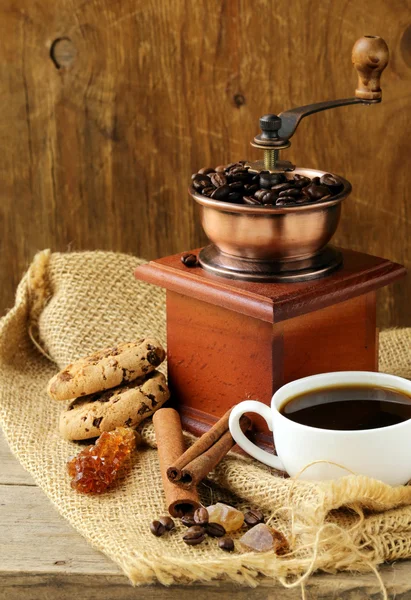 Still life of wooden coffee grinder, sugar, biscuits — Stock Photo, Image