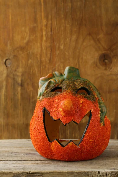 Halloween pumpkin Jack O'Lantern on a wooden background — Stock Photo, Image