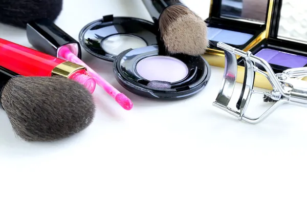 Makeup set (shadows, lipstick, brush) on a white background — Stock Photo, Image