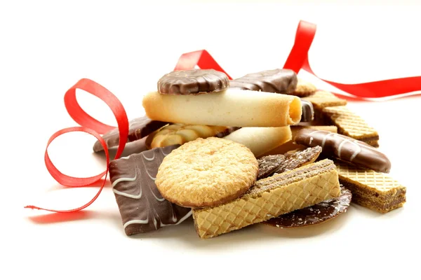 Assorted cookies with chocolate and nuts on white background — Stock Photo, Image