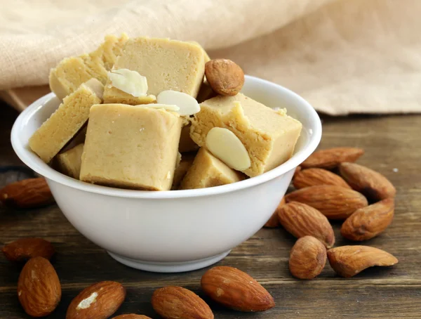 Almond paste - marzipan in a bowl with whole nuts — Stock Photo, Image