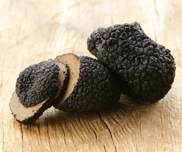 Delicacy mushroom black truffle - rare and expensive vegetable — Stock Photo, Image