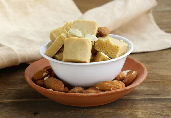 Almond paste - marzipan in a bowl with whole nuts — Stock Photo, Image