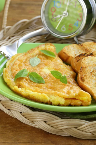 Fresh egg omelet with basil for breakfast — Stock Photo, Image