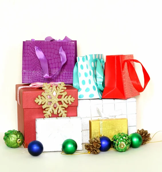 Many gift boxes and colorful shopping bags on white background Stock Image