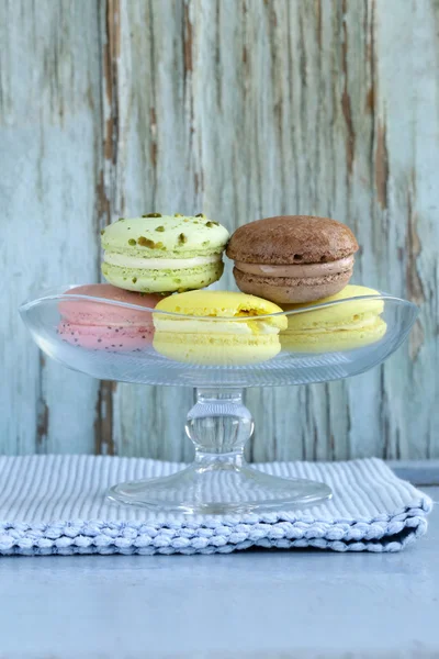 French multicolored macaroons on a vintage wooden background — Stock Photo, Image