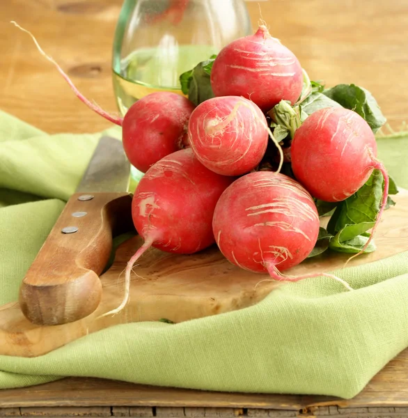 Juicy ripe radish on a wooden table — Stock Photo, Image