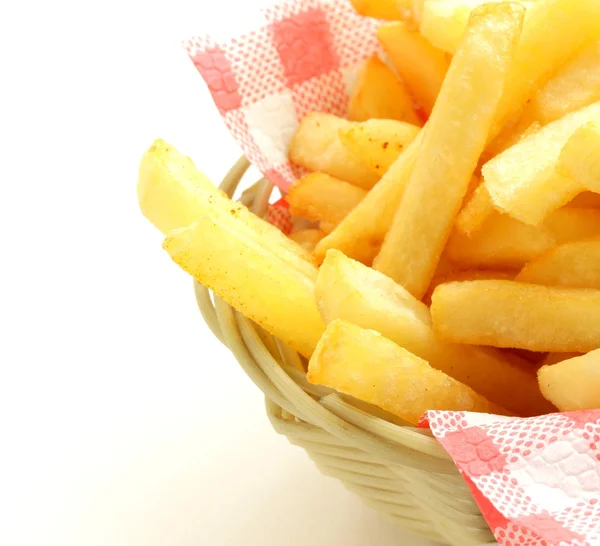 Traditional French fries in a wicker basket — Stock Photo, Image