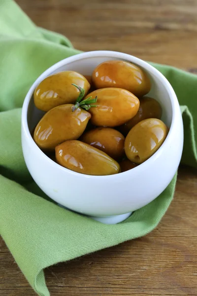 Green marinated olives in a white bowl — Stock Photo, Image