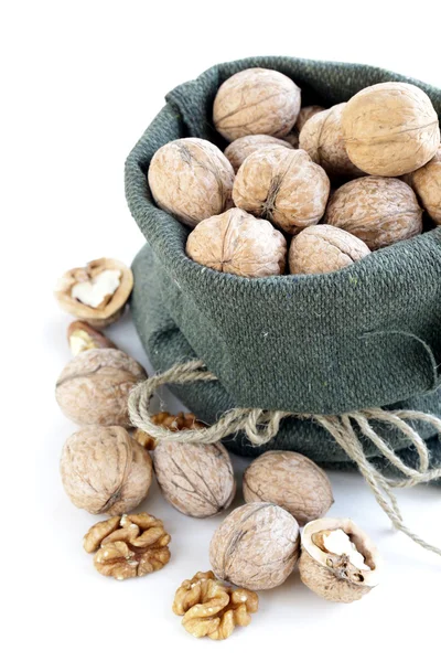 Linen bag with whole ripe walnuts — Stock Photo, Image