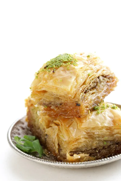 Turkish arabic dessert baklava with honey and nuts on a silver plate — Stock Photo, Image