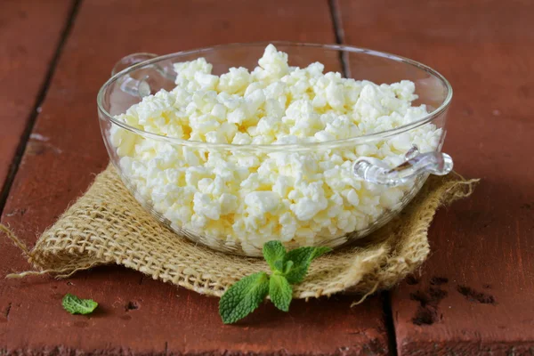 Fresh natural organic cottage cheese in a glass bowl — Stock Photo, Image