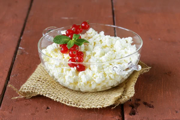 Fresh natural organic cottage cheese in a glass bowl — Stock Photo, Image