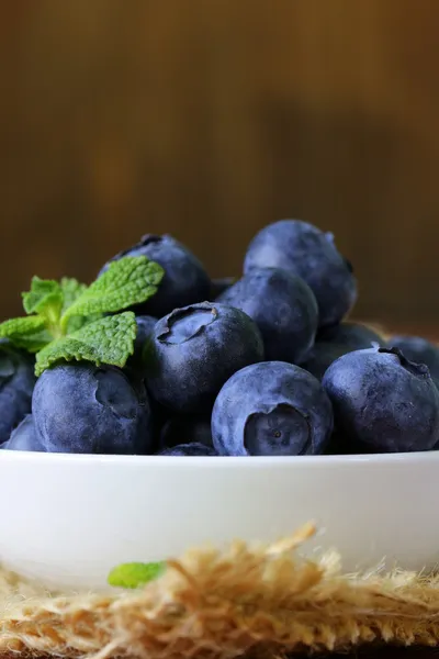 Fresh organic ripe blueberries on a wooden table — Stock Photo, Image