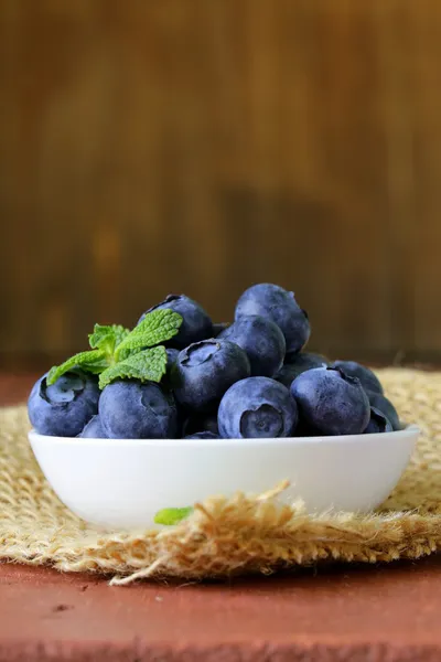 Fresh organic ripe blueberries on a wooden table — Stock Photo, Image