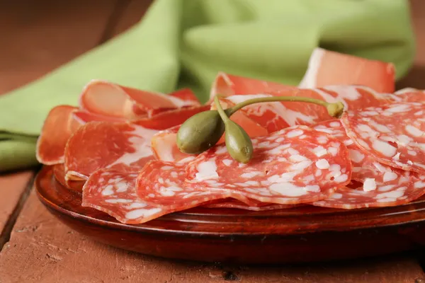 Sliced dried sausage meat (ham, prosciutto, salami) — Stock Photo, Image