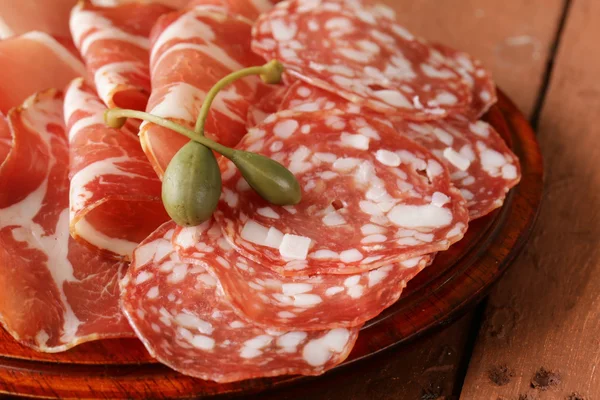 Sliced dried sausage meat (ham, prosciutto, salami) — Stock Photo, Image
