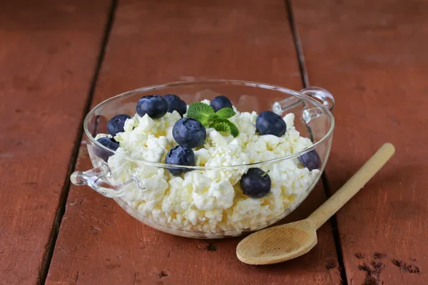 Fresh natural organic cottage cheese in a glass bowl — Stock Photo, Image