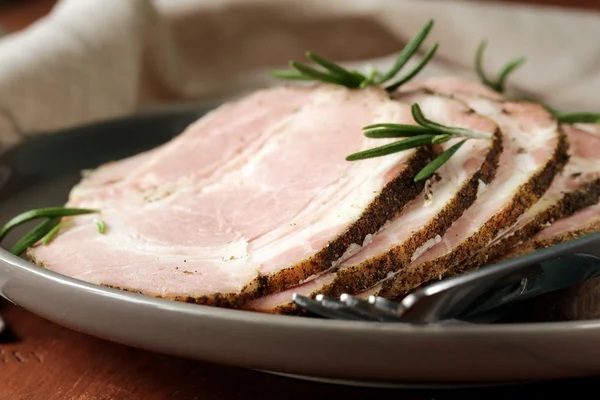 Roasted pork neck with black pepper and herbs — Stock Photo, Image