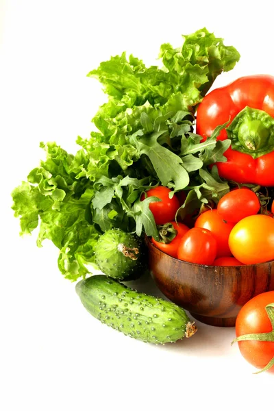 Various vegetables (avocado, cucumbers, parsley, bell pepper, tomato) — Stock Photo, Image