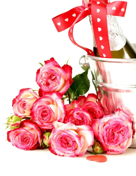 Romantic still life champagne, roses, gifts, chocolate — Stock Photo, Image