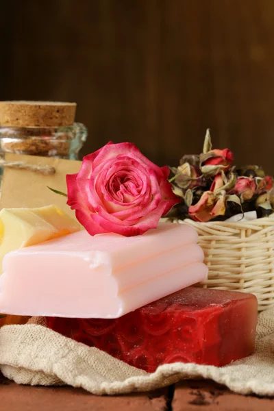 Handmade soap with the scent of roses on a wooden table — Stock Photo, Image