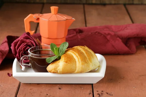 Elegant coffee break or breakfast cup of coffee and croissant — Stock Photo, Image