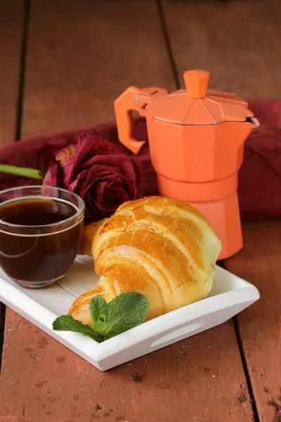 Elegant coffee break or breakfast cup of coffee and croissant — Stock Photo, Image