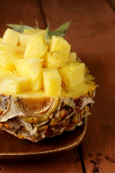 Dessert pineapple sliced on a wooden plate — Stock Photo, Image