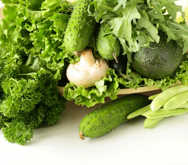 Various green vegetables (avocado, green peas, cucumbers, parsley, lettuce) — Stock Photo, Image