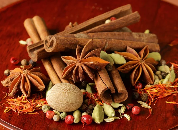 Various spices (nutmeg, cinnamon, star anise, saffron, pepper, cardamom, fennel) — Stock Photo, Image