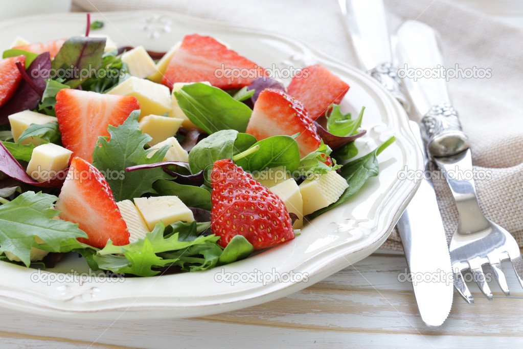 Gourmet salad with fresh strawberries and cheese