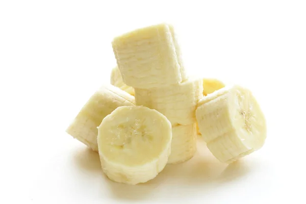 Fresh ripe banana cut into pieces on white background — Stock Photo, Image