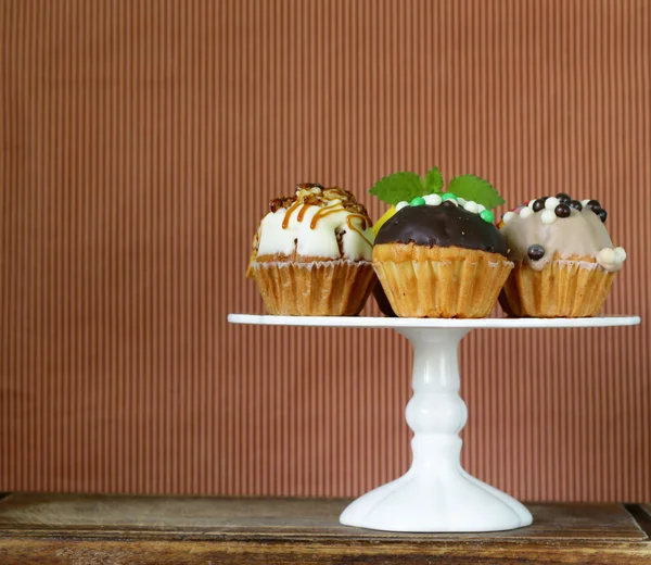 Holiday desserts, different decorated cupcakes on the stand — Stock Photo, Image