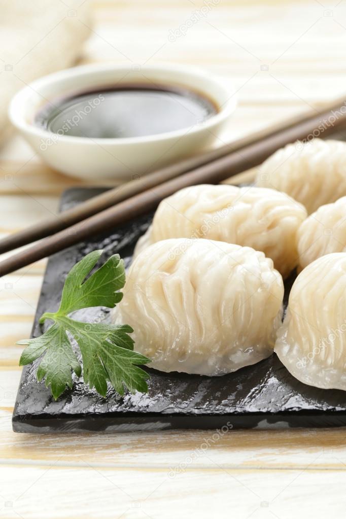 Asian steamed meat dumplings dim sum with soy sauce