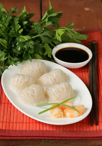 Asian steamed meat dumplings dim sum with soy sauce