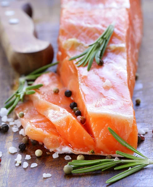 Salty delicacy red salmon fish on wooden board — Stock Photo, Image
