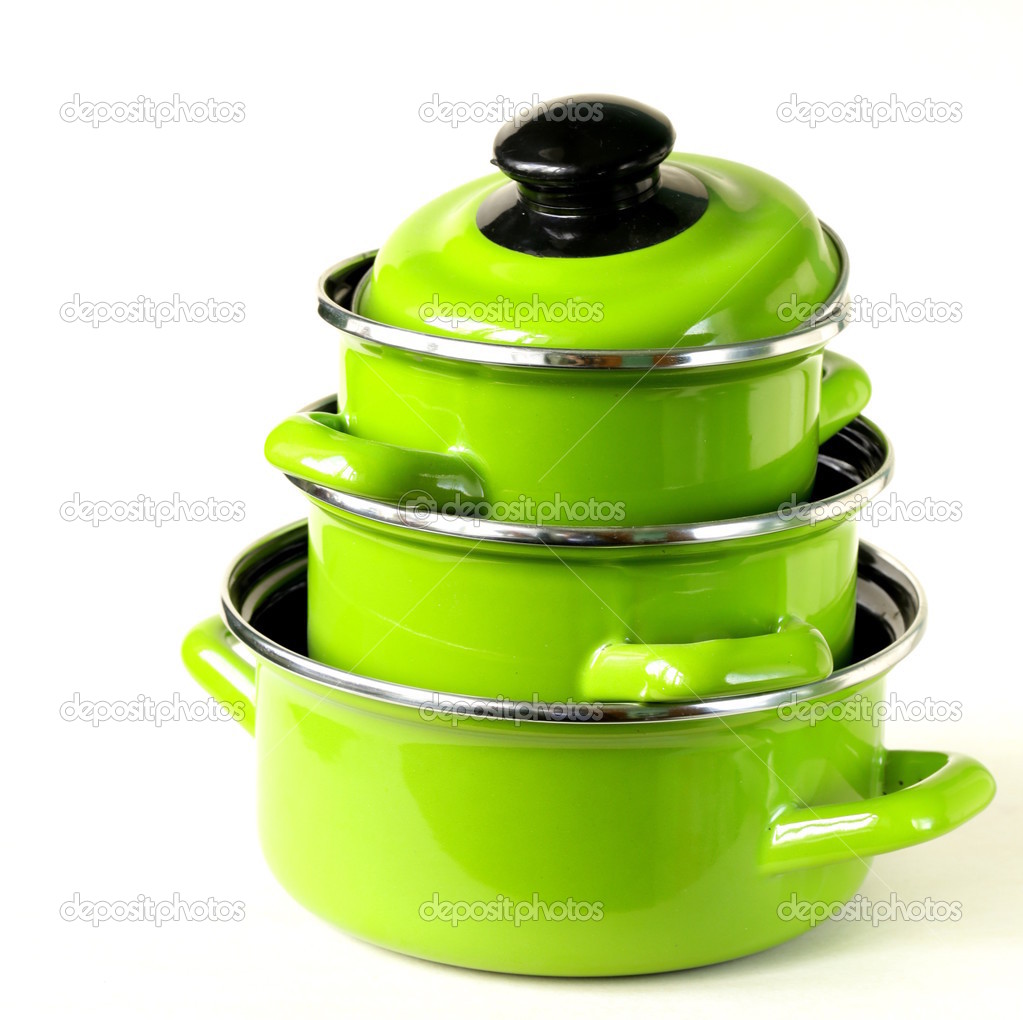 Set of metal green pots on a white background